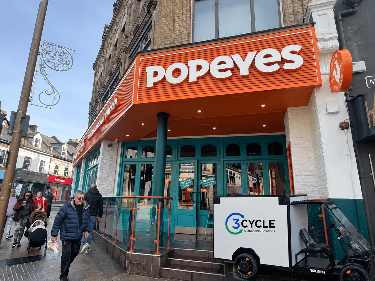 3Cycle electric cargo vehicle outside a Popeyes restaurant in London